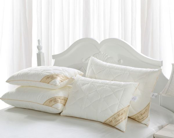 Какие подушки лучше: лебяжий пух или бамбук